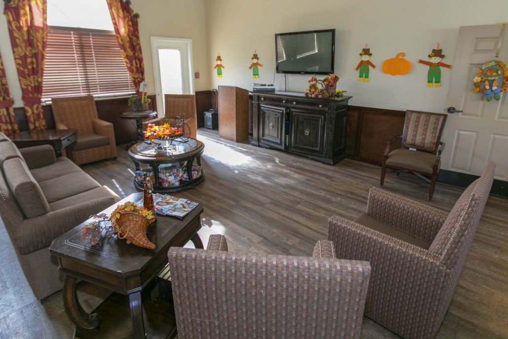 A cozy living room with comfortable seating and a television.