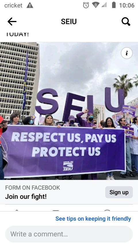 A group of people holding signs and a banner with the message 'RESPECT US, PAY US, PROTECT US' during a protest.