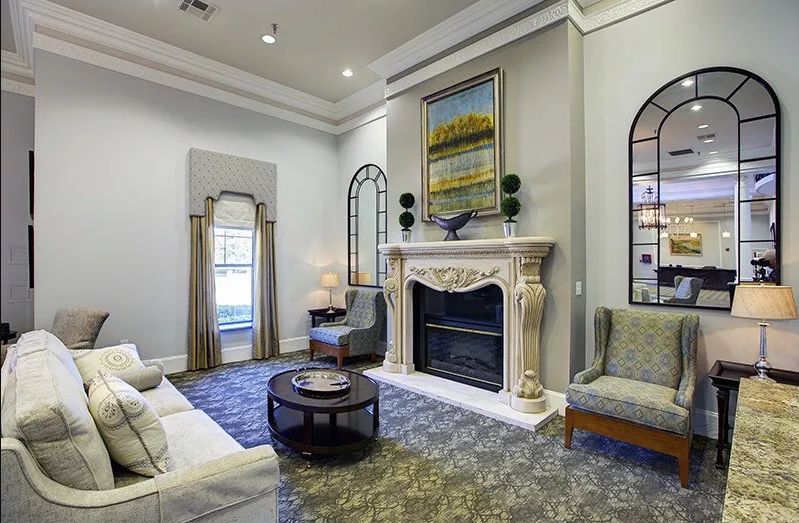 Elegant living room with a classic fireplace and sophisticated decor.