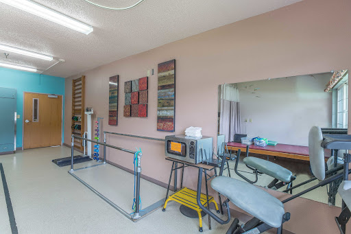 A well-equipped physical therapy room designed for rehabilitation exercises.