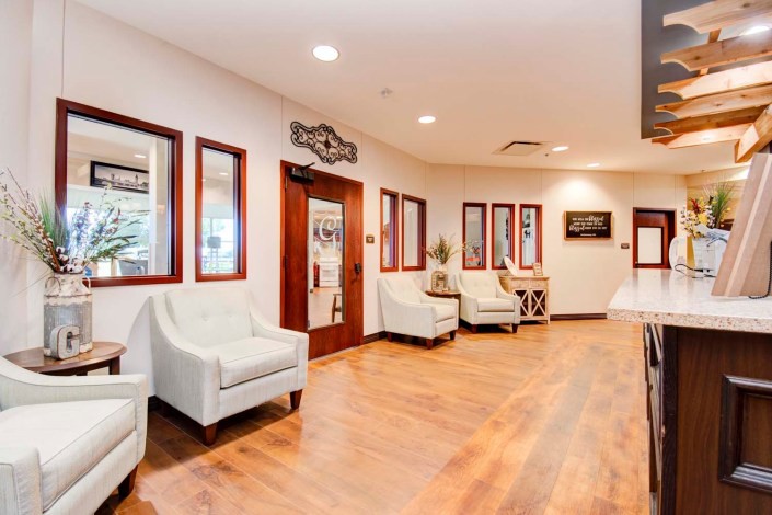 A well-lit waiting area with comfortable chairs and stylish decor.