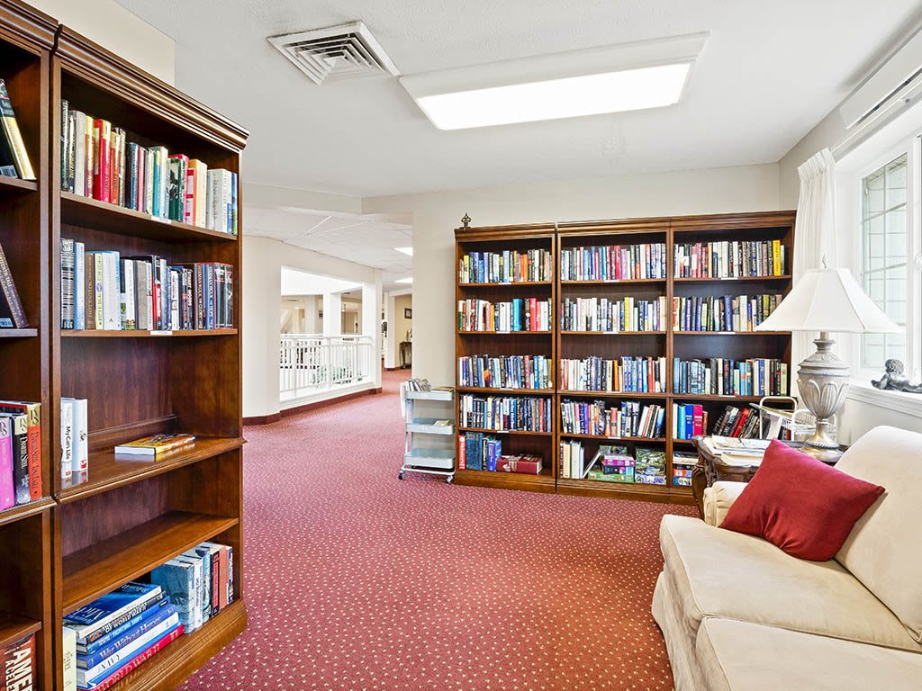 Cozy library interior with bookshelves and a comfortable reading area.
