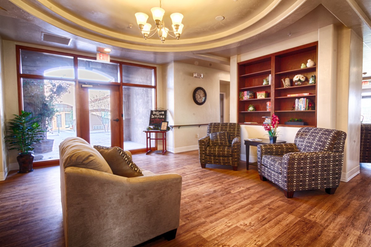 A cozy lobby with comfortable seating and warm lighting.