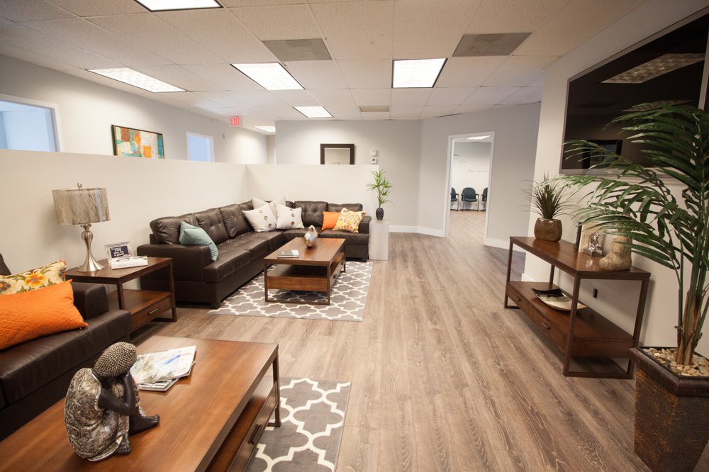 A modern living room with a comfortable couch and stylish decor.