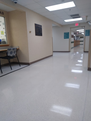 A clean and well-lit hallway in a hospital.