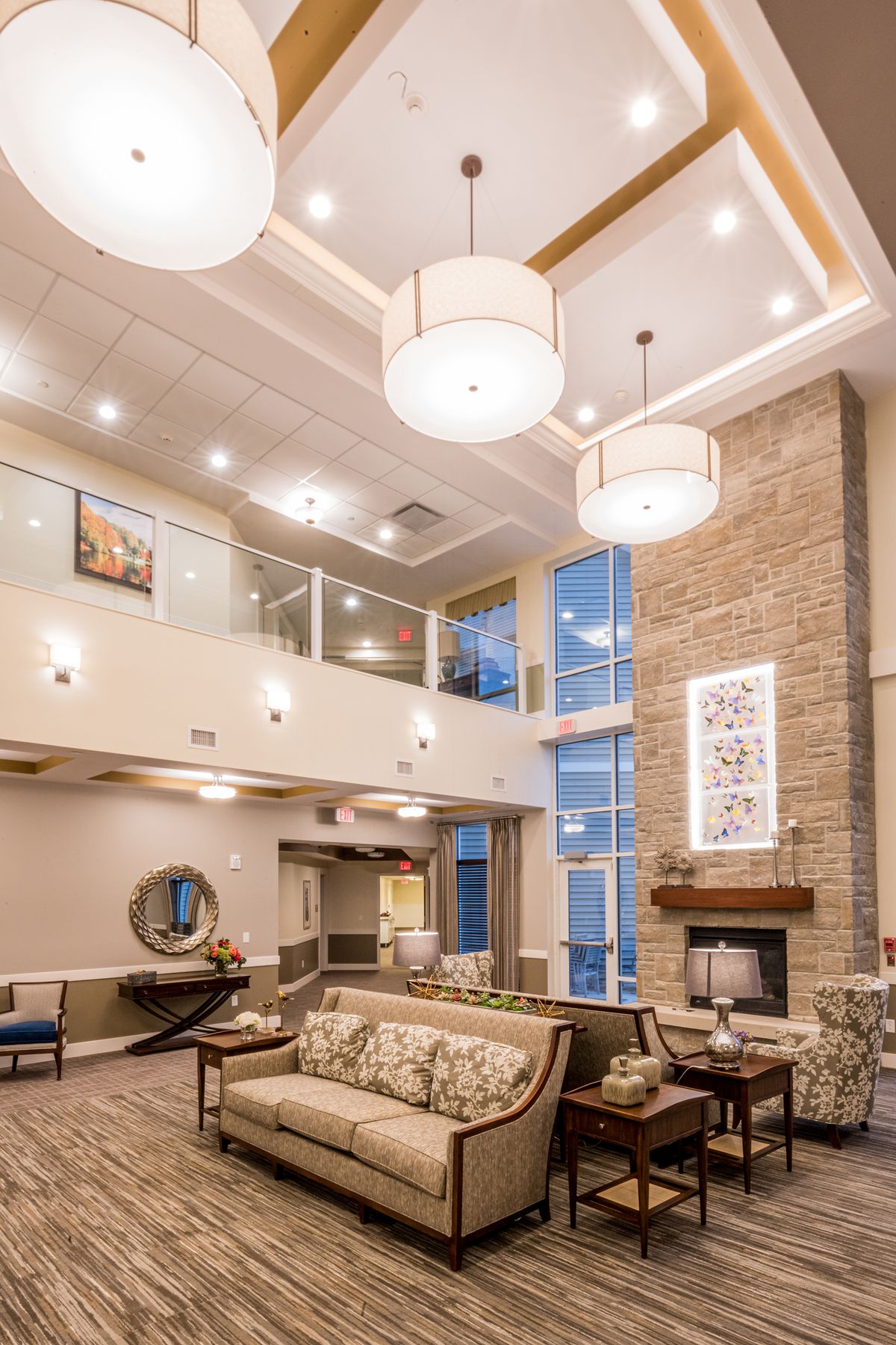 A modern and spacious lobby area with elegant furniture and lighting.