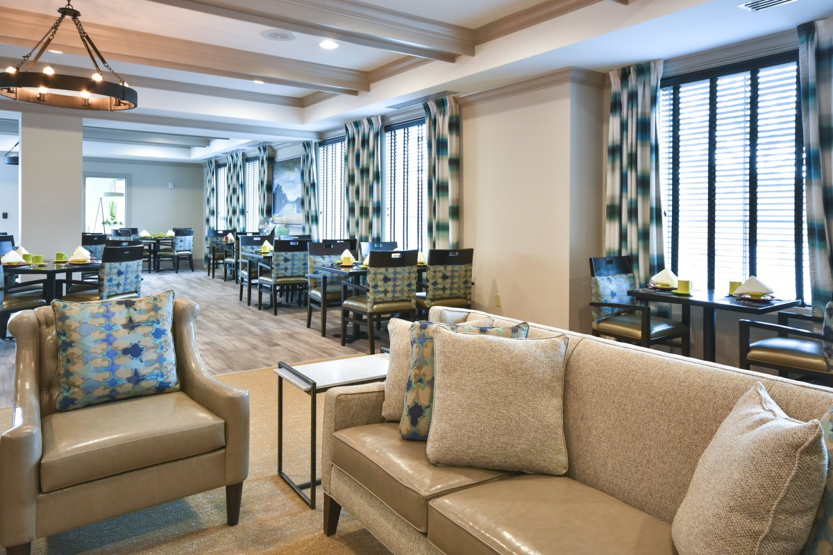 A spacious lounge with modern seating and dining areas.