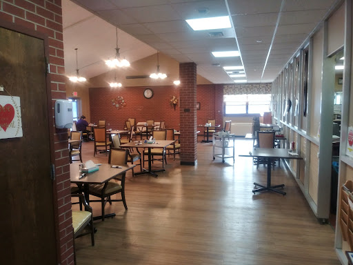 A spacious and inviting dining area with wooden tables and chairs.