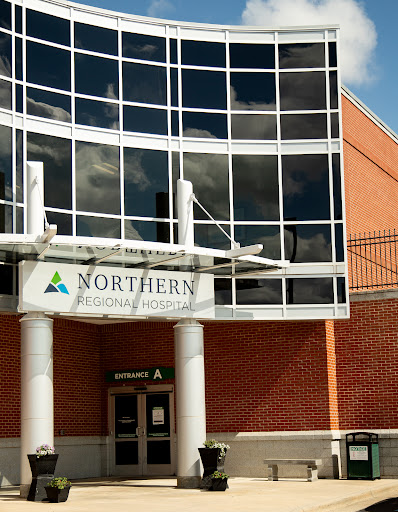 Exterior view of the Northern educational institution with modern glass architecture.