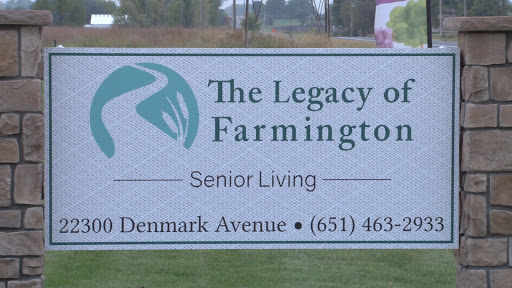 Sign for The Legacy of Farmington, a senior living community located on Denmark Avenue.