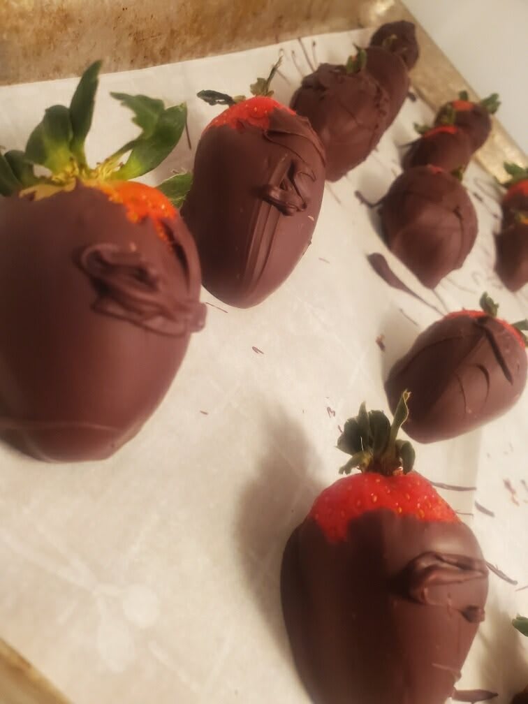 Delicious chocolate-covered strawberries arranged on a surface.