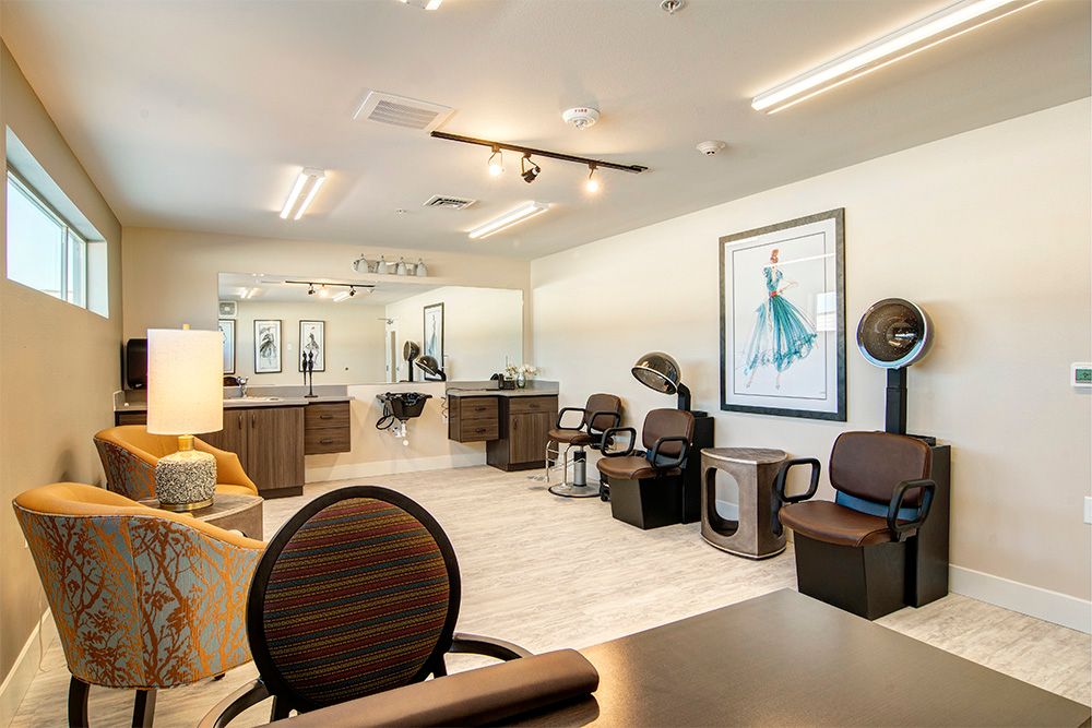 A modern hair salon interior with chairs, mirrors, and styling equipment.