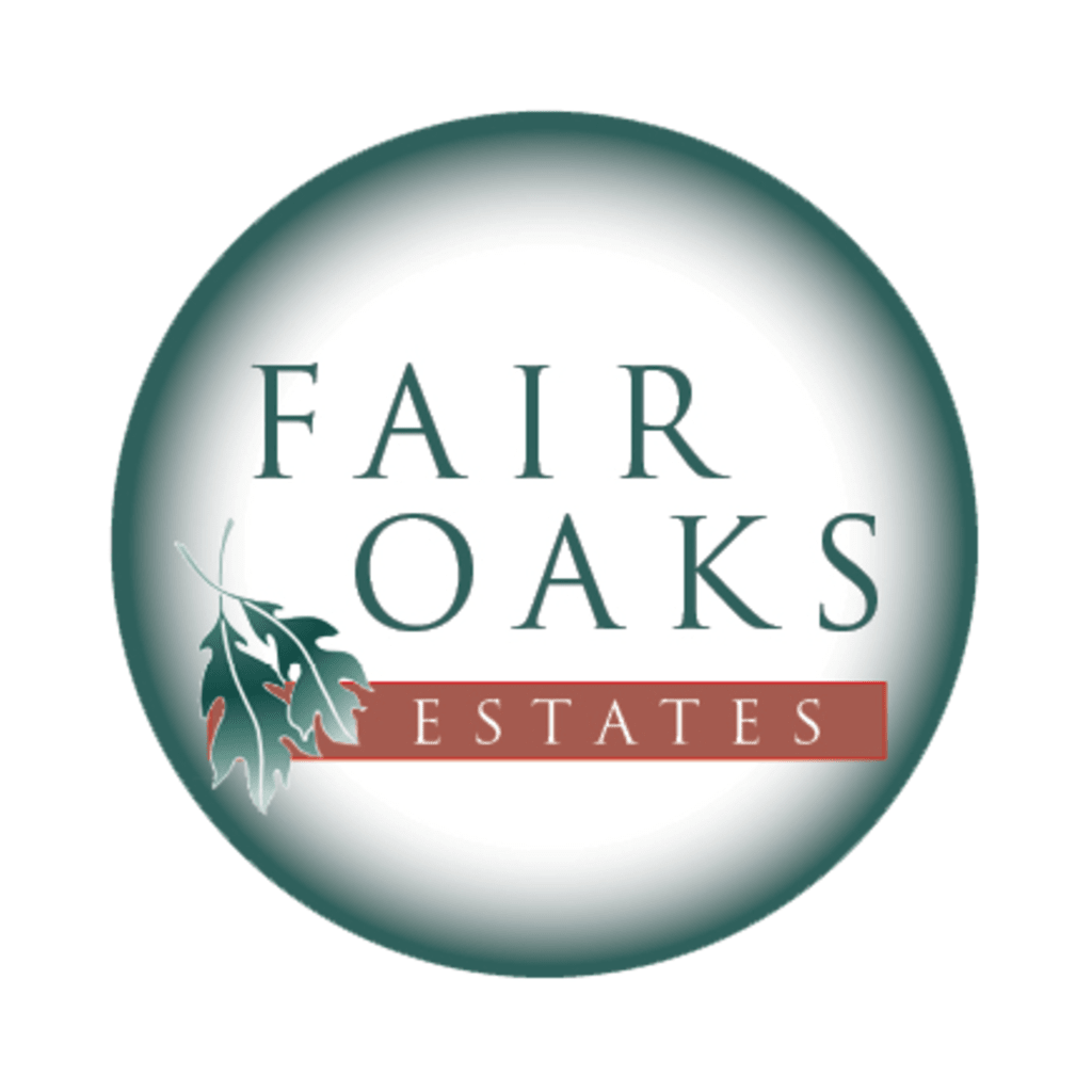 Logo for Fair Oaks Estates featuring a circular design with text and an oak leaf graphic.