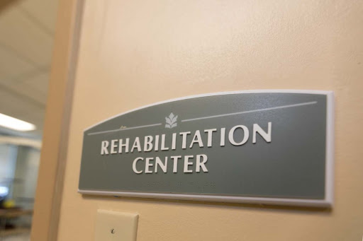 Sign indicating the entrance to a Rehabilitation Center.