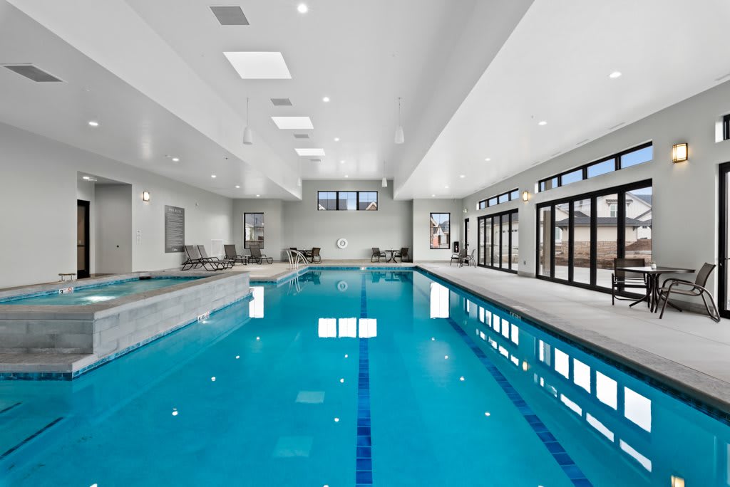 A spacious indoor swimming pool with a modern and sleek design.