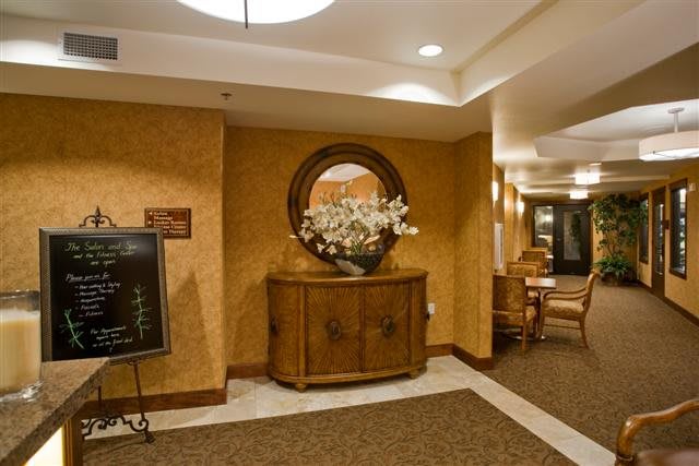 Spacious hotel lobby with elegant decor and furnishings.