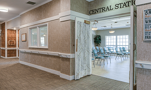 A view of an interior meeting space with chairs and a sign reading 'Central Station'.