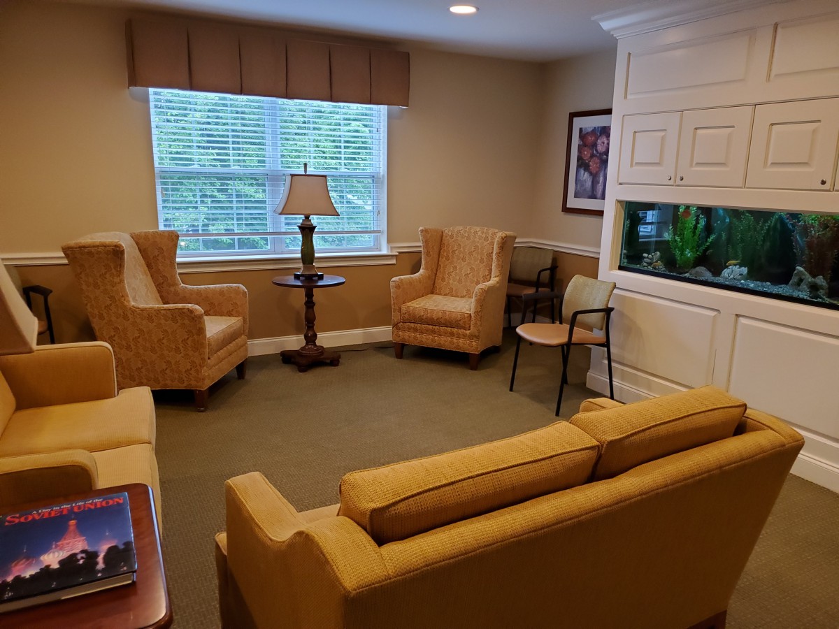 A cozy living room with comfortable seating and warm lighting.