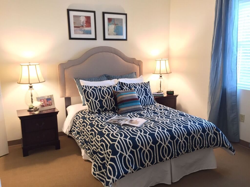 A cozy bedroom with stylish bedding and elegant decor.