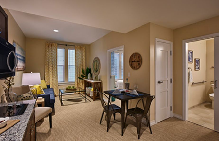 A cozy living and dining area with stylish furnishings and warm decor.