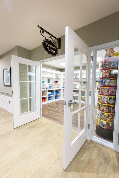 A welcoming bookstore entrance with shelves filled with books and magazines.