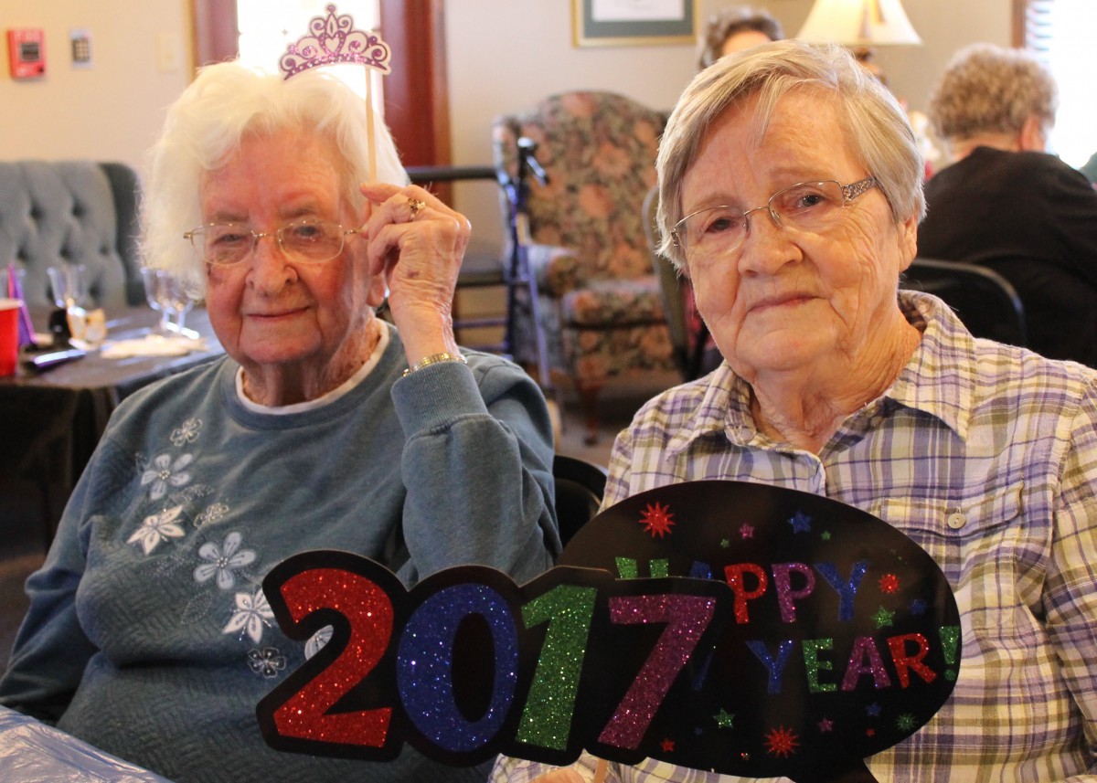 Two elderly women celebrating New Year's Eve 2017.