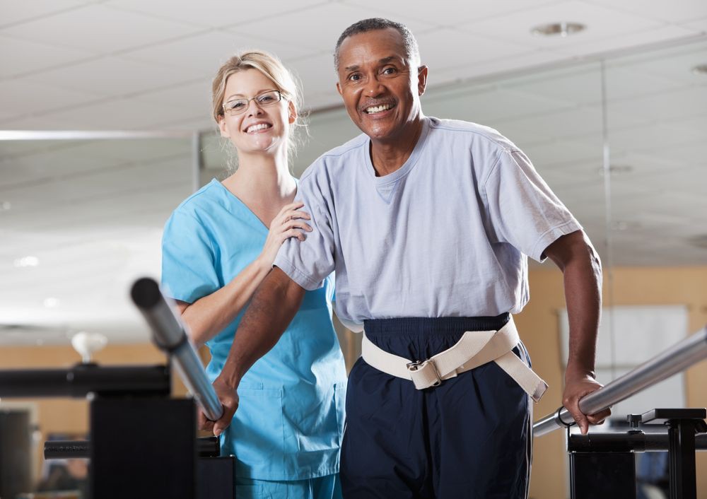 A therapist assists a patient during a rehabilitation session.