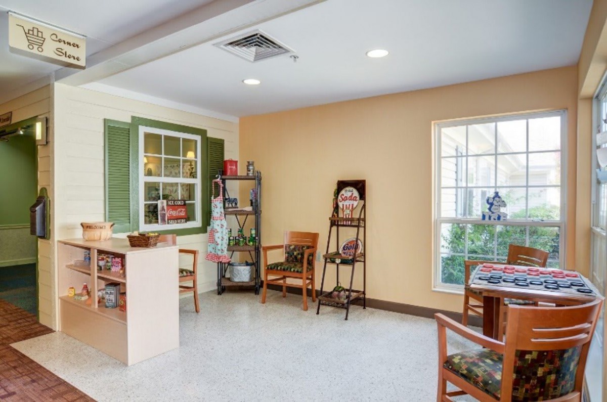 A cozy waiting room with chairs and decor.