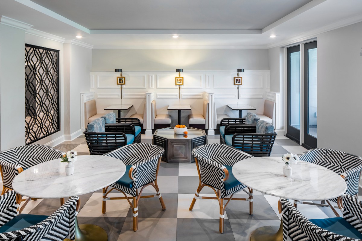 A modern cafe interior with stylish seating and elegant decor.