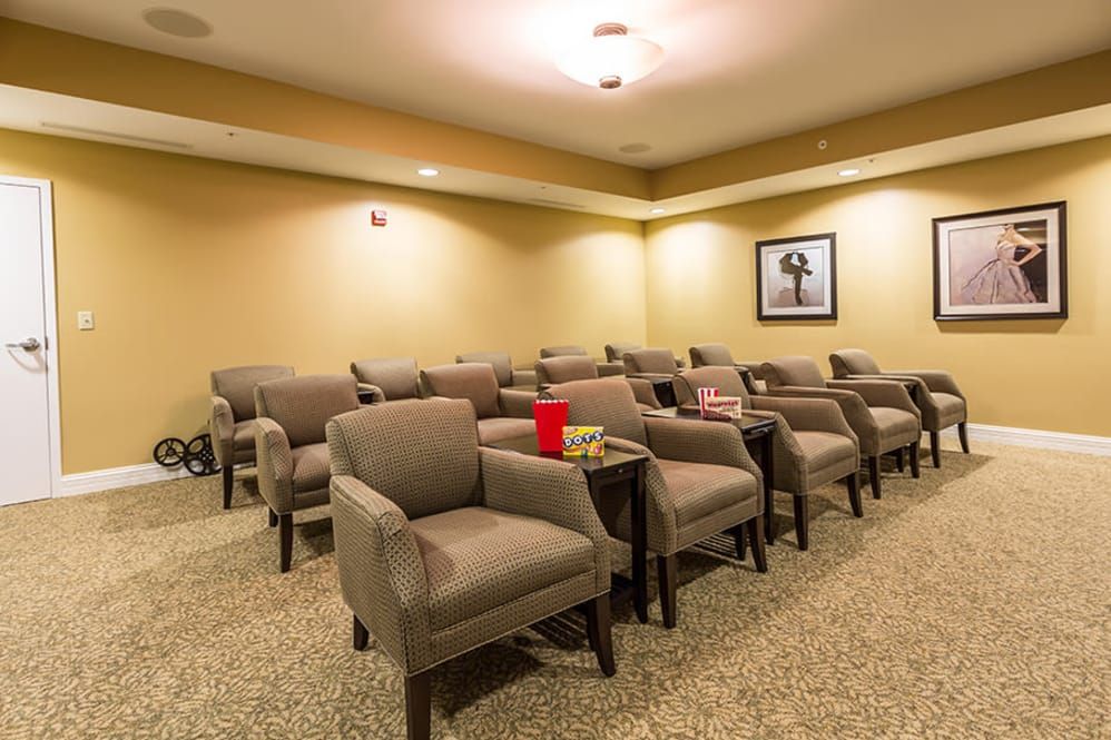 A cozy seating area with arranged chairs, possibly a waiting or conference room.