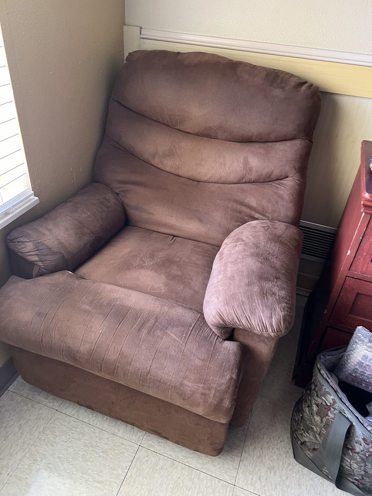 A plush brown recliner placed in a cozy corner of the room.