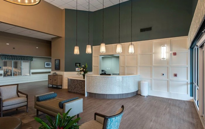 A modern reception area with pendant lights and comfortable seating.