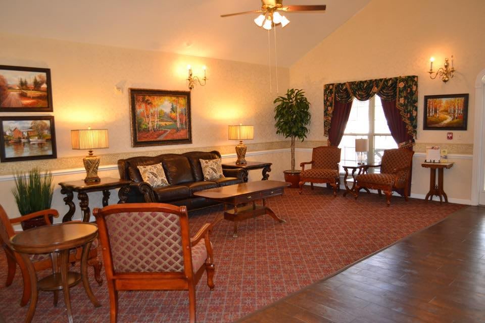 A cozy living room with elegant furniture and warm lighting.