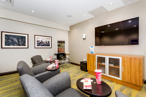 A cozy lounge area featuring comfortable seating, entertainment options, and snack availability.