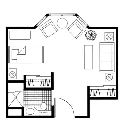A compact apartment floor plan featuring a bedroom, living area, and bathroom.