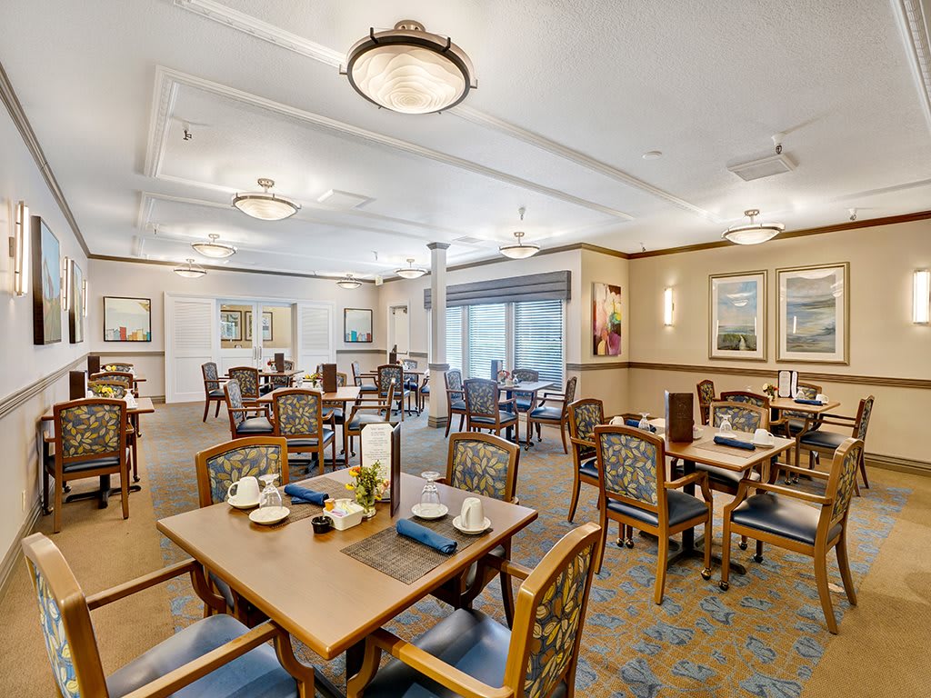 Elegant dining room with neatly arranged tables and classic decor.