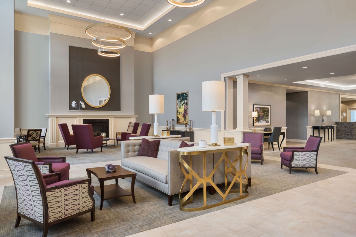 A luxurious and modern hotel lobby with elegant seating arrangements and sophisticated decor.
