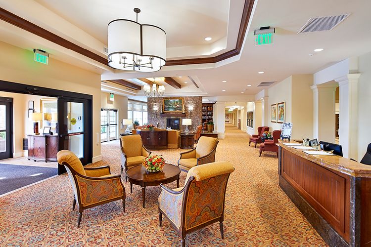 A cozy lobby interior with elegant seating and a reception desk.