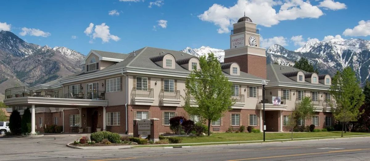A classic building with a prominent clock tower and clear skies.