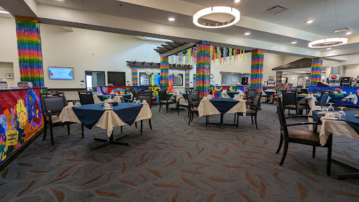 A vibrant restaurant interior featuring colorful decor and neatly arranged tables.