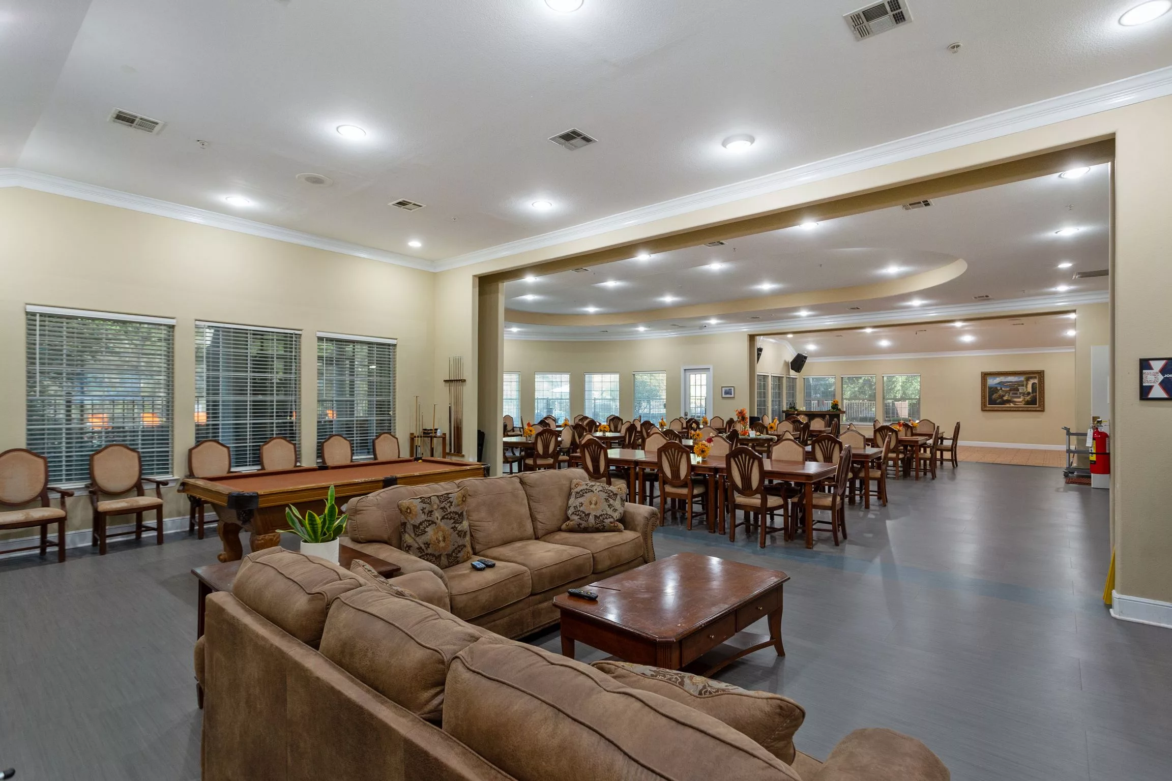 A spacious interior with comfortable sofas and a large dining area.
