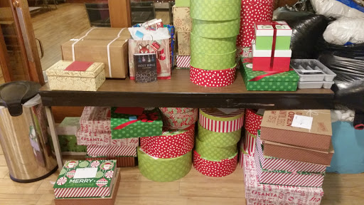 An assortment of colorful gift boxes and containers ready for holiday gifting.