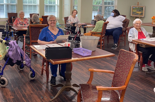 Residents engaged in activities at a senior community center.