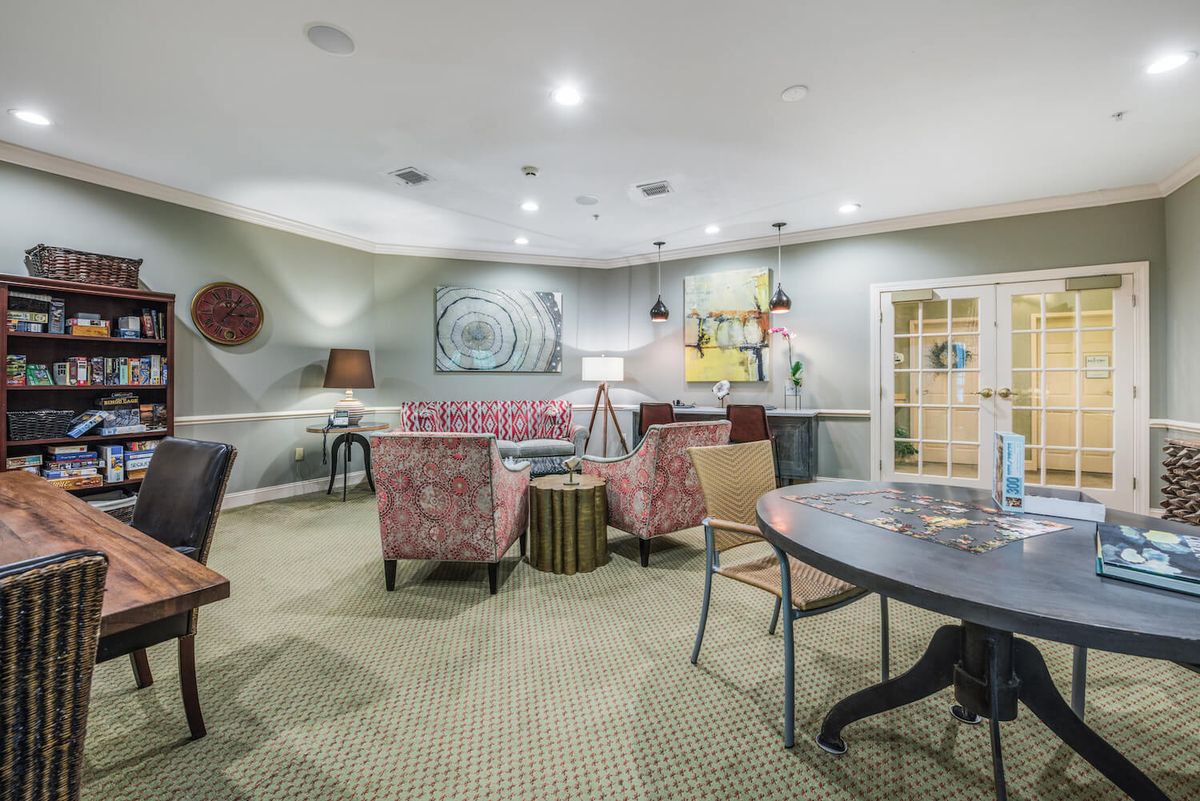 A modern living room with stylish furniture and decorative elements.