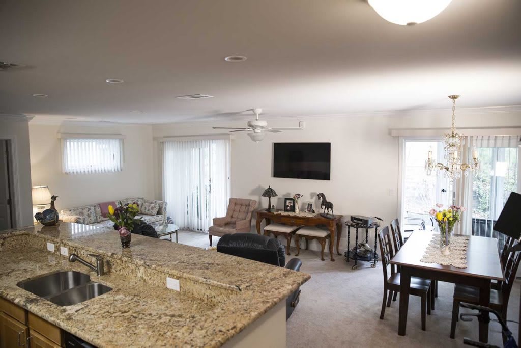 A spacious open floor plan featuring a kitchen, dining area, and living space.