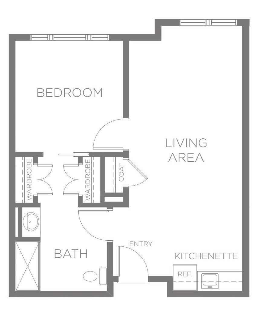 This is a floor plan of an apartment, featuring a bedroom, living area, bathroom, and kitchenette.