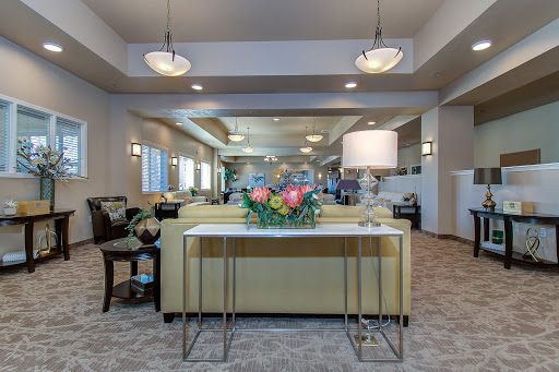 A beautifully designed lobby featuring modern furniture and floral decor.