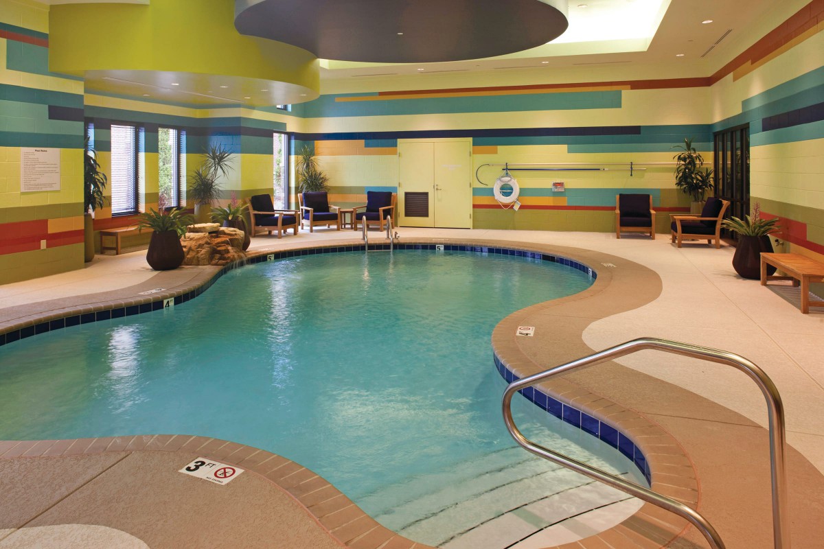 An inviting indoor swimming pool in a hotel setting, perfect for relaxation and leisure activities.