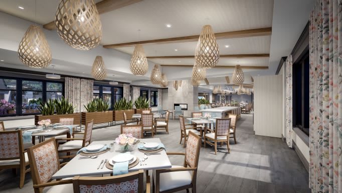 A beautifully designed modern restaurant interior with elegant lighting and neatly arranged tables.