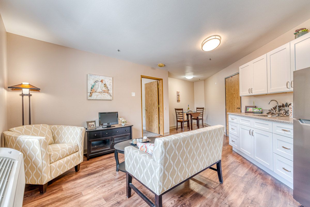 A modern living room with comfortable seating and elegant decor.